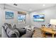 Living room with ocean views, comfy seating and TV for relaxing after a day at the beach at 601 Longboat Club Rd # 504S, Longboat Key, FL 34228