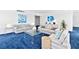 Inviting living room with comfortable sofas, a glass coffee table, and blue color accents at 601 Longboat Club Rd # 504S, Longboat Key, FL 34228