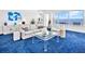 Cozy living room with a view of the ocean and a white couch at 601 Longboat Club Rd # 504S, Longboat Key, FL 34228