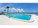Exterior shot showcasing a large pool with beach in the background at 601 Longboat Club Rd # 504S, Longboat Key, FL 34228