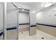 Community shower area is freshly tiled and provides shower seating and multiple shower heads for convenience at 601 Longboat Club Rd # 504S, Longboat Key, FL 34228