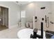 Modern bathroom with soaking tub, tiled shower, and ample space at 6140 Bobby Jones Ct, Palmetto, FL 34221