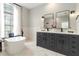 A luxurious bathroom with a soaking tub and double vanity sinks at 6140 Bobby Jones Ct, Palmetto, FL 34221