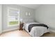 Well-lit bedroom with large window, natural light, hardwood floor, and simple yet stylish decor at 6140 Bobby Jones Ct, Palmetto, FL 34221
