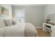 Bright bedroom with a vanity, white furniture, and a peaceful ambiance at 6140 Bobby Jones Ct, Palmetto, FL 34221