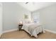Serene bedroom with a queen bed, soft lighting, and a minimalist aesthetic at 6140 Bobby Jones Ct, Palmetto, FL 34221