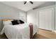 Inviting bedroom featuring a closet, a large window, light hardwood floor, and minimalist decor at 6140 Bobby Jones Ct, Palmetto, FL 34221