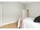Minimalist bedroom with hardwood floors, neutral decor, and a calming ambiance at 6140 Bobby Jones Ct, Palmetto, FL 34221