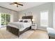 Spacious bedroom with a king-size bed, sliding door to the patio, neutral tones, and abundant natural light at 6140 Bobby Jones Ct, Palmetto, FL 34221