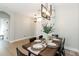 Elegant dining room featuring modern lighting, table set for dinner, and adjacent to living space at 6140 Bobby Jones Ct, Palmetto, FL 34221