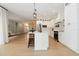 Well-lit kitchen with white cabinets, stainless steel appliances, and an island with seating at 6140 Bobby Jones Ct, Palmetto, FL 34221