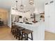 Bright kitchen featuring white cabinetry, a central island with seating, and stainless steel appliances at 6140 Bobby Jones Ct, Palmetto, FL 34221