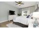 Cozy main bedroom featuring a ceiling fan, tv, and natural light at 6140 Bobby Jones Ct, Palmetto, FL 34221