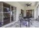 Enclosed patio with a ceiling fan, a table and chairs for lounging at 6140 Bobby Jones Ct, Palmetto, FL 34221