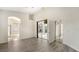 Bedroom featuring wood floors, sliding glass doors to the pool area, and an en-suite bath at 6213 Willet Ct, Lakewood Ranch, FL 34202