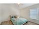 Cozy bedroom with a comfortable bed, neutral colors, and natural light from the window at 6213 Willet Ct, Lakewood Ranch, FL 34202