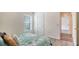 Bedroom featuring a large window, comfortable bed, and doorway into another room at 6213 Willet Ct, Lakewood Ranch, FL 34202