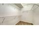 Spacious walk-in closet with wood floor and multiple wire shelves for optimal storage and organization at 6213 Willet Ct, Lakewood Ranch, FL 34202