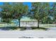 Community center and recreation area featuring lush greenery and a white picket fence, perfect for neighborhood gatherings at 6213 Willet Ct, Lakewood Ranch, FL 34202