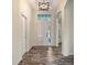 Welcoming entryway features hardwood flooring, arched doorways, and a view into adjacent rooms at 6213 Willet Ct, Lakewood Ranch, FL 34202
