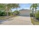 Charming single-story home with a well-manicured lawn and mature trees at 6213 Willet Ct, Lakewood Ranch, FL 34202