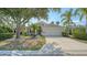Charming single-story home with a well-manicured lawn and mature trees at 6213 Willet Ct, Lakewood Ranch, FL 34202