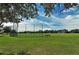 Expansive green field with soccer goals and baseball cage, ideal for outdoor sports and recreational activities at 6213 Willet Ct, Lakewood Ranch, FL 34202