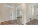 Bright foyer featuring wood flooring, arched entryway, and lots of natural light at 6213 Willet Ct, Lakewood Ranch, FL 34202