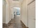 Hallway with wood flooring, showcasing the transition to an open concept living space at 6213 Willet Ct, Lakewood Ranch, FL 34202