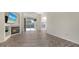 Spacious living room with fireplace, built-in shelving, and sliding glass doors to the outdoors at 6213 Willet Ct, Lakewood Ranch, FL 34202