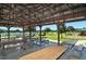 Interior view of pavilion with picnic tables and playground in the background at 6213 Willet Ct, Lakewood Ranch, FL 34202