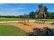 A fun playground featuring stepping stones and climbing dome, set in a green space perfect for activities at 6213 Willet Ct, Lakewood Ranch, FL 34202