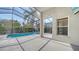 This is an enclosed pool and patio with a spa and well-maintained landscaping at 6213 Willet Ct, Lakewood Ranch, FL 34202