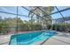 The pool is enclosed and offers a spa with stunning blue tile and tropical landscaping at 6213 Willet Ct, Lakewood Ranch, FL 34202