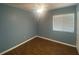 Cozy bedroom with wood flooring, natural light, and a ceiling fan at 6618 Kenwood Dr, North Port, FL 34287