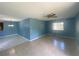 This large living room features tile flooring and a large window providing plenty of natural light at 6618 Kenwood Dr, North Port, FL 34287