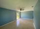 The living room features tile floors and sliding doors that offer access to the lanai and backyard at 6618 Kenwood Dr, North Port, FL 34287