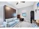 Guest bedroom offering a comfortable sofa bed and a built-in Murphy bed at 6636 35Th E Ct, Sarasota, FL 34243