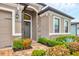 Charming home entrance with a beautiful door, detailed brickwork, and manicured landscaping at 6636 35Th E Ct, Sarasota, FL 34243