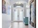 Elegant foyer with mosaic glass doors, high ceilings, stylish decor, and tile flooring at 6636 35Th E Ct, Sarasota, FL 34243