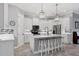 Stylish kitchen featuring an island with seating, stainless steel appliances, and recessed lighting at 6636 35Th E Ct, Sarasota, FL 34243