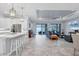 Open-concept living room boasts tile floors, recessed lighting, and seamless transition to the outdoor pool area at 6636 35Th E Ct, Sarasota, FL 34243