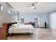 Bright main bedroom with stylish furnishings, light wood floors and neutral wall tones at 6636 35Th E Ct, Sarasota, FL 34243
