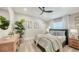 Cozy bedroom with neutral tones, comfortable bedding, and ample natural light at 6641 Saint James Xing, University Park, FL 34201