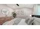 Bright bedroom with a large bed, stylish decor, and plenty of natural light at 6641 Saint James Xing, University Park, FL 34201