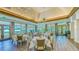 Elegant dining room with natural light, decorative chandeliers, and beautiful views at 6641 Saint James Xing, University Park, FL 34201