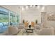 Comfortable living room showcasing a view of the pool through sliding glass doors and neutral furniture at 6641 Saint James Xing, University Park, FL 34201