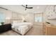 Bright main bedroom featuring a plush bed, neutral colors, and ample natural light at 6641 Saint James Xing, University Park, FL 34201