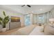 Modern bedroom featuring a king bed, TV, and sliding doors leading to the patio at 6641 Saint James Xing, University Park, FL 34201
