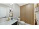 Elegant powder room featuring a modern vanity and a unique accent wall at 6641 Saint James Xing, University Park, FL 34201